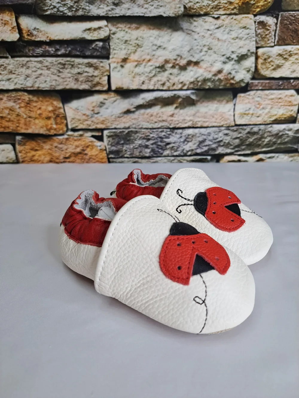 Baby White Leather Slip-On Shoes with Red Ladybug Detail